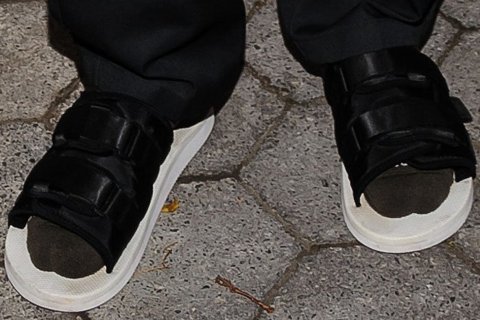 Kanye West in socks and sandals.