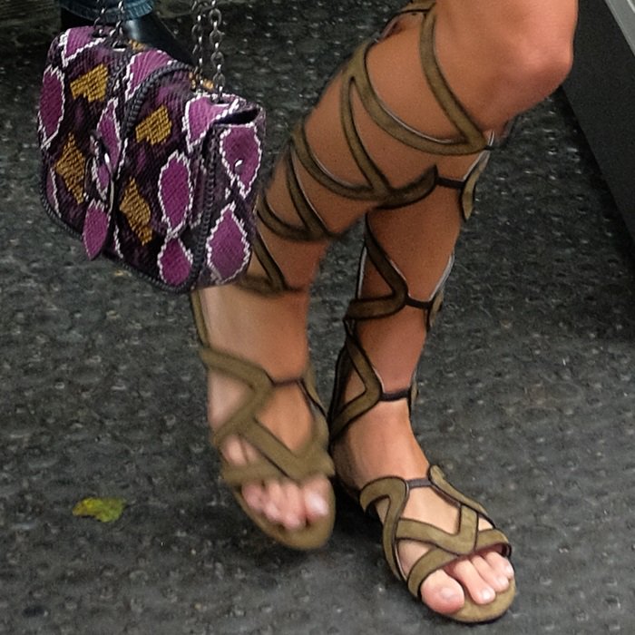 Kendall Jenner shows off her spider toes in flat Grecian-inspired gladiator sandals