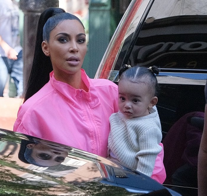 Kim Kardashian spotted with Chicago, who was born via surrogate back in January, in her arms