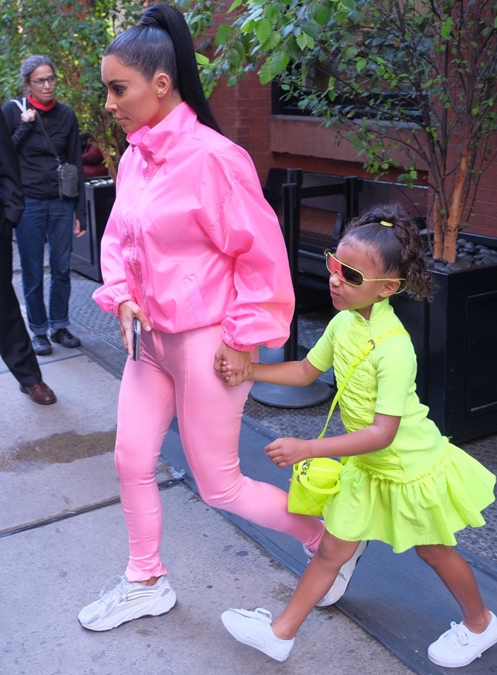 Kim Kardashian styled her pink Balenciaga stretch-satin skinny pants with Yeezy sneakers