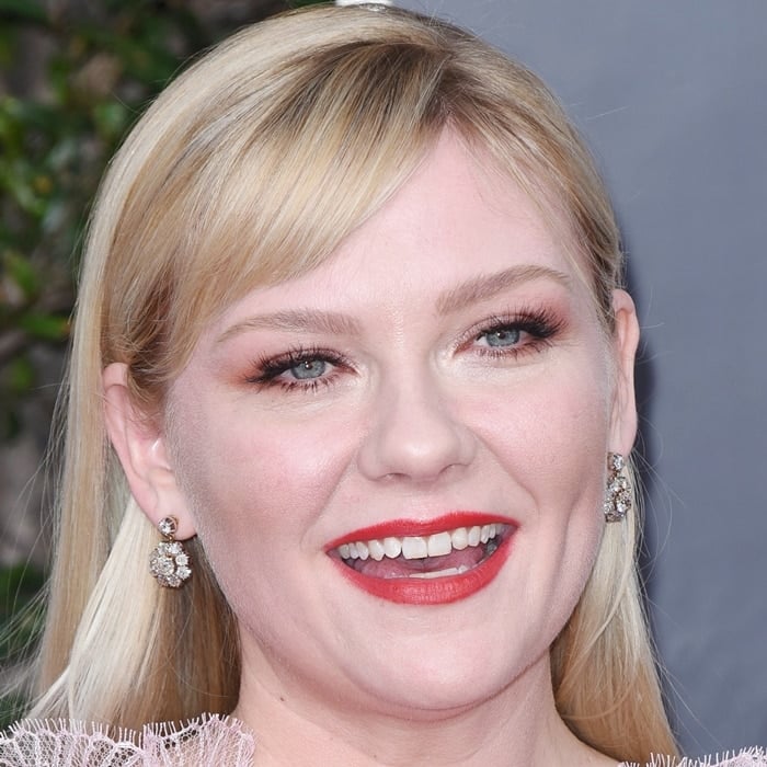 Kirsten Dunst shows off her teeth at the 77th Annual Golden Globe Awards