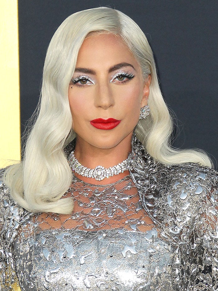 Lady Gaga wearing silver eyeshadow, red lipstick, and Bulgari jewelry.