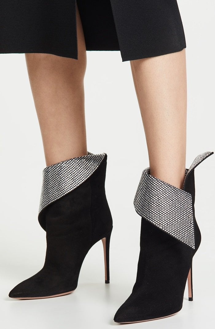 Aquazzura’s black Night Fever ankle boots cite the spirit of disco music, resulting in this striking style