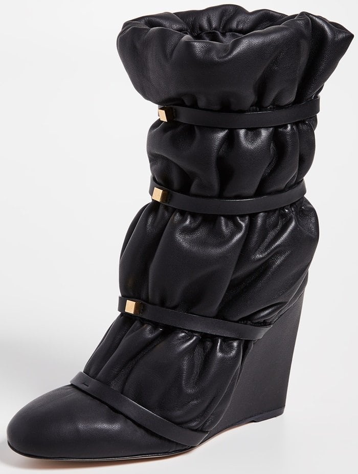 Would you wear these glossy leather boots cinched with studded leather straps?