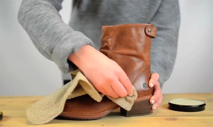 Polishing your leather boots with a soft cloth helps maintain their shine while protecting the material from scuffs and wear