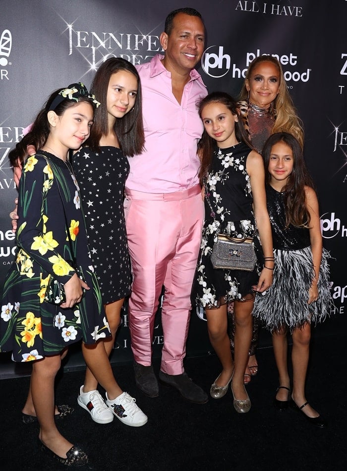 Jennifer Lopez and Alex Rodriguez pose with their stylishly dressed family, showcasing coordinated looks perfect for the glamorous finale of J.Lo's residency