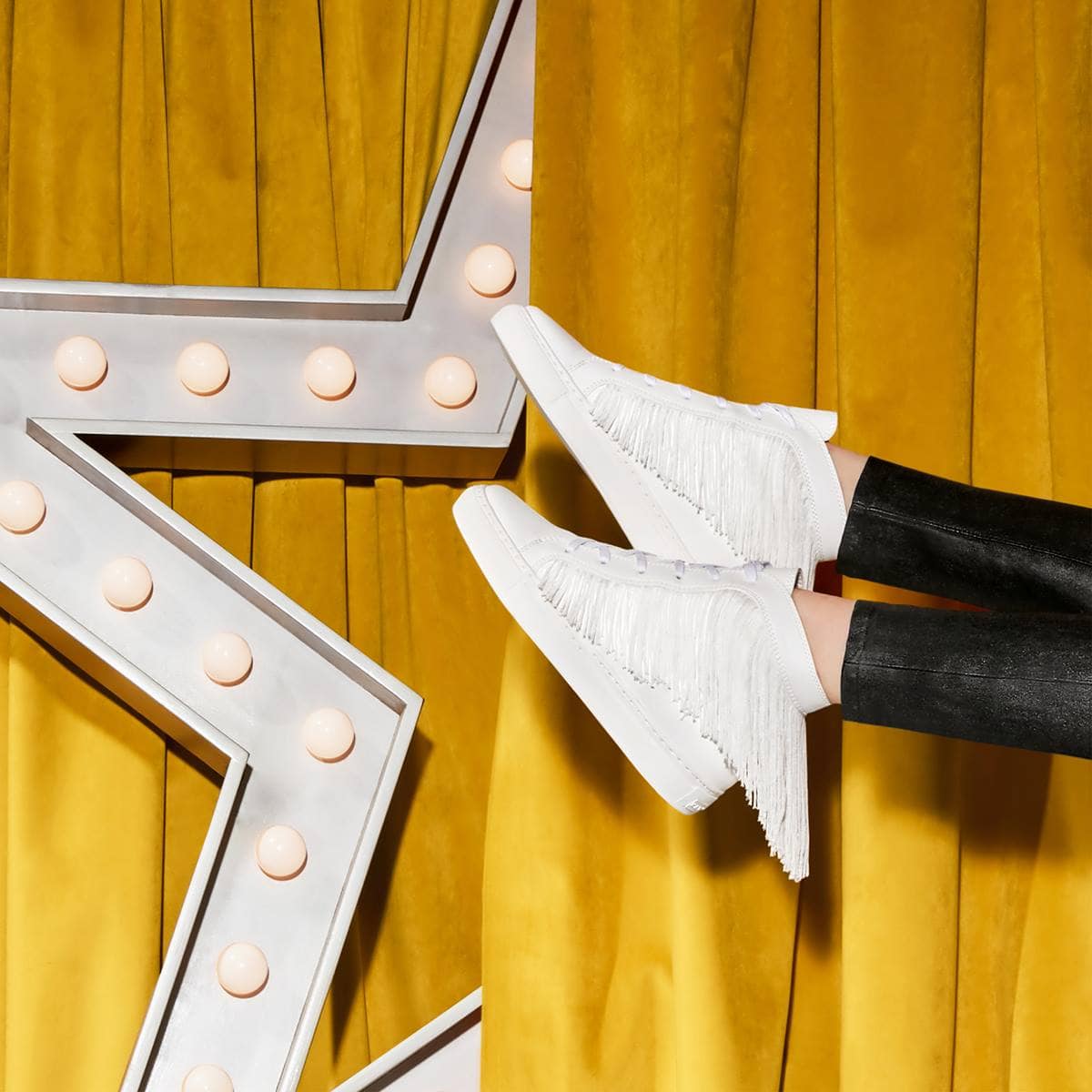 These sporty sneaks with flirty fringe details are sure to shake up any look