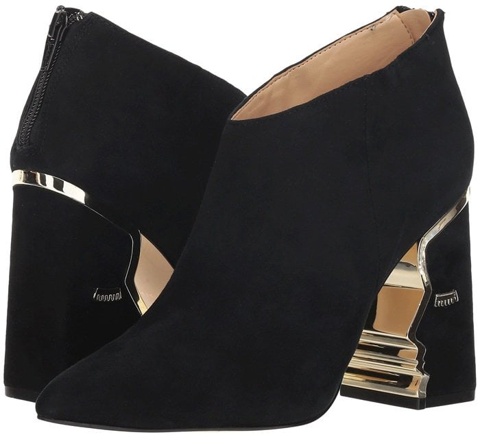 Heeled ankle boots with suede upper featuring face silhouette and hardware detailing
