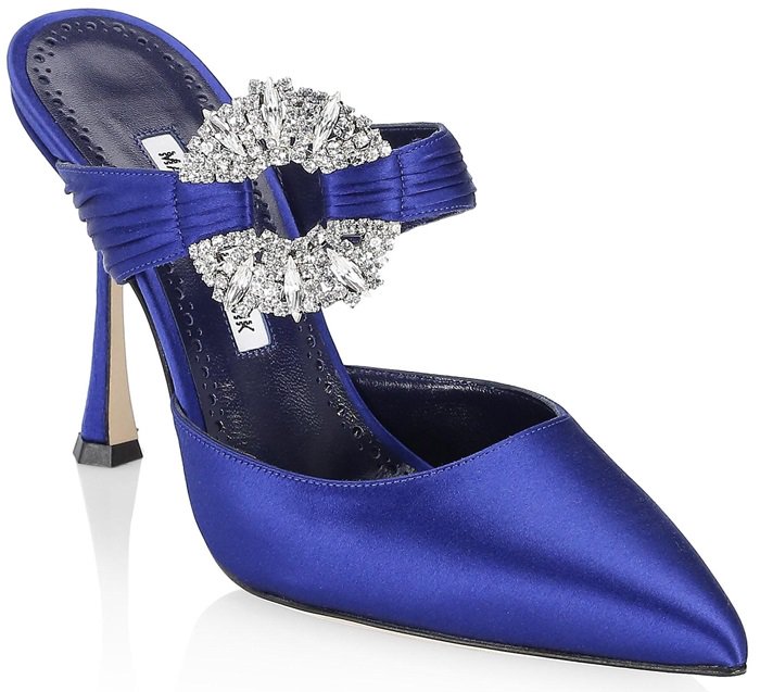 These gorgeous mules are handmade in Italy of lustrous satin and finished with an oversized crystal-embellished silvertone detail and a leg-lengthening stiletto heel