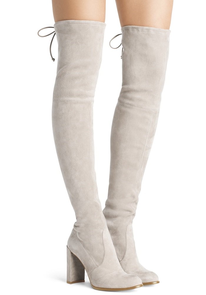 Over-the-knee boots are a fashion staple, and these tantalizing thigh-highs are elevated with a straight block heel and finished with Stuart Weitzman's signature tie back detail for a flawless fit