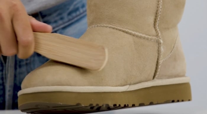 Use a suede brush and brush in a single direction to restore the original appearance