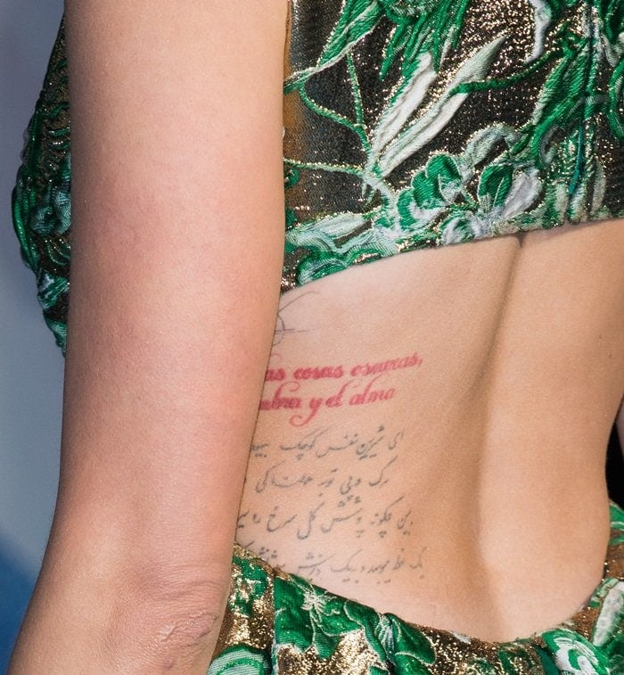 Amber Heard's Persian (Farsi) body tattoo is a phrase by Omar Khayyam