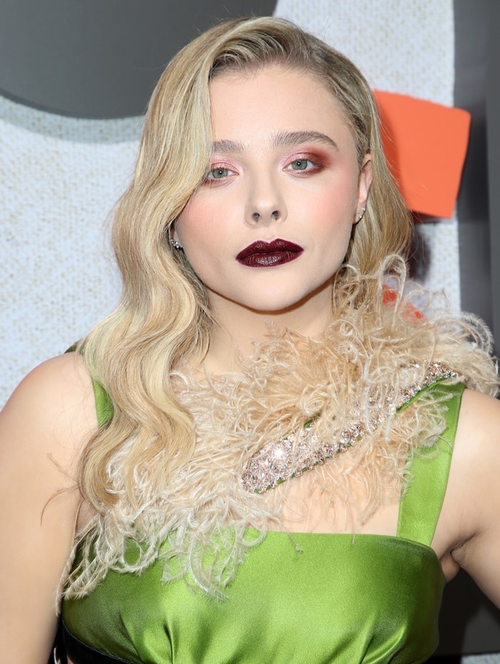 Chloë Grace Moretz with horrible makeup in a sexy cutout dress at the premiere of Suspiria