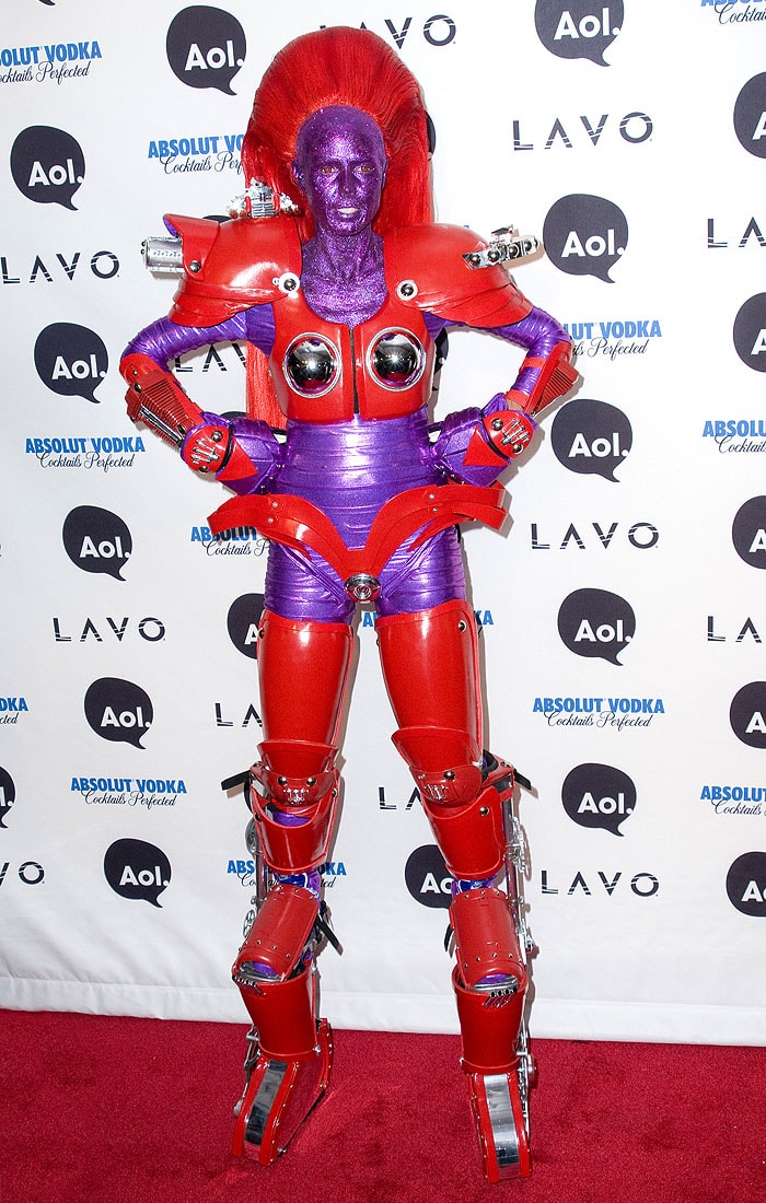 Heidi Klum dressed as a red-armored, glittery purple robot for Halloween 2010