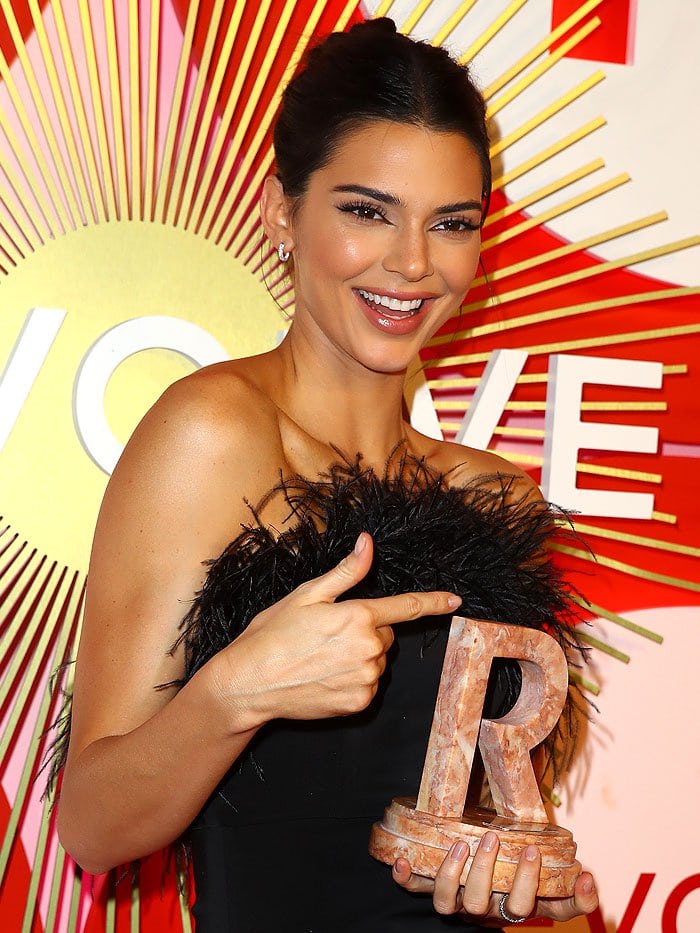 Kendall Jenner accepting her Icon of the Year award at the 2nd Annual Revolve Awards