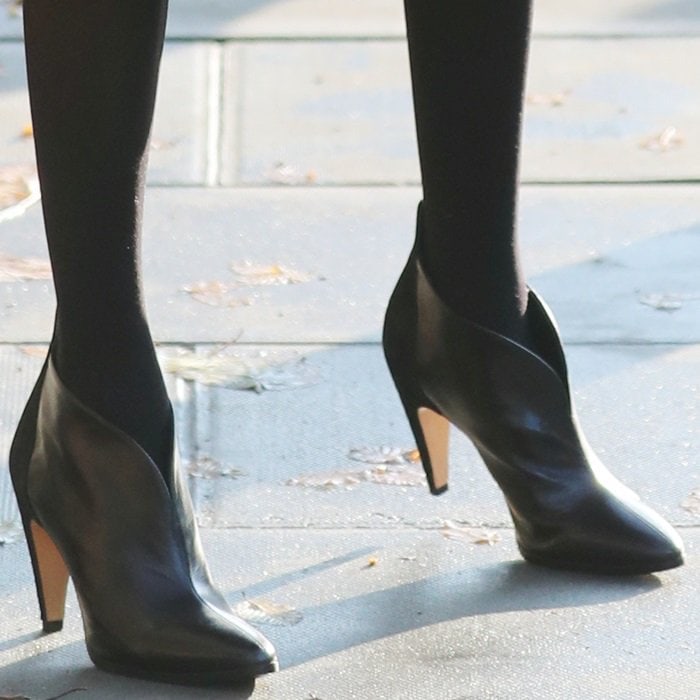 Meghan Markle styled her heeled booties with black stockings