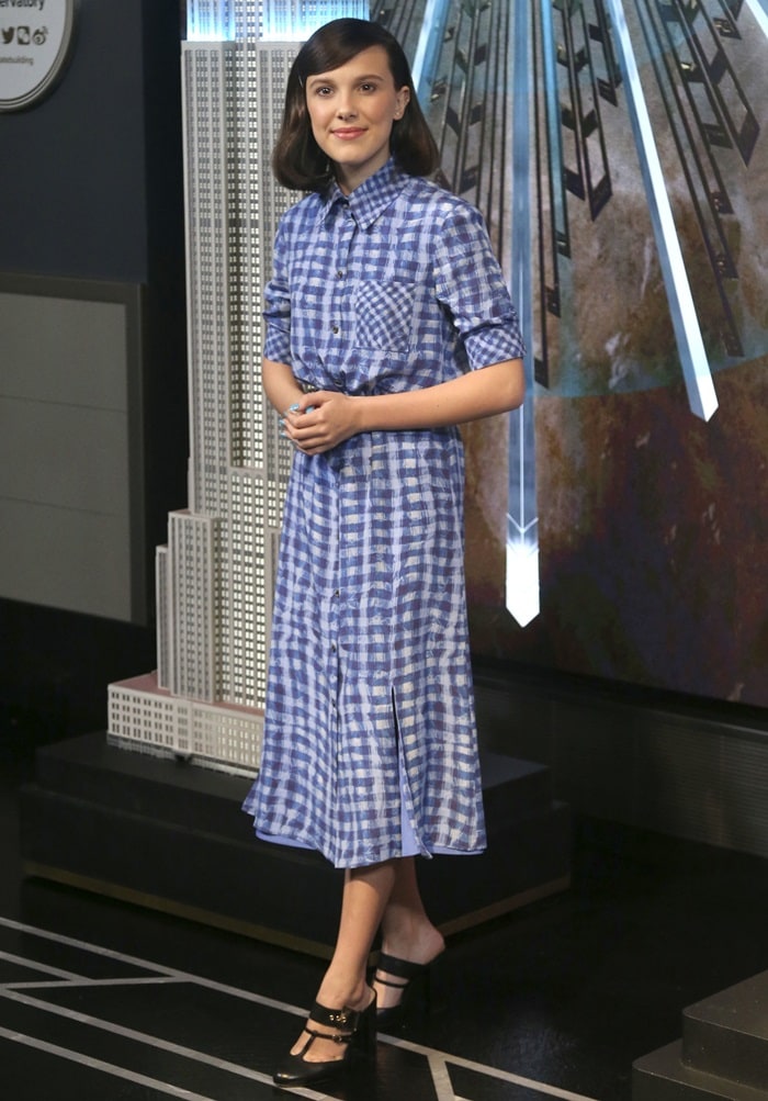 Millie Bobby Brown flashes her legs in a blue, plaid Altuzarra Spring 2019 dress