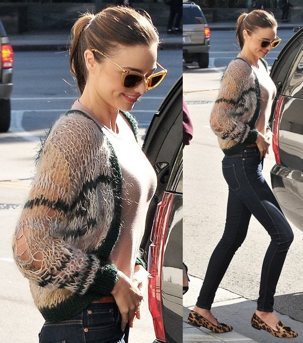 Miranda Kerr wearing a cropped knit sweater and dark-washed skinny jeans