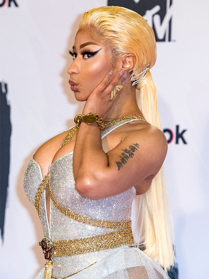 Nicki Minaj showing off thick, caked-on makeup and her blonde lace-front ponytail wig