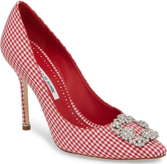 A crystal-encrusted ornament adds eye-catching romance to an Italian pump in a classic pointy-toe profile.