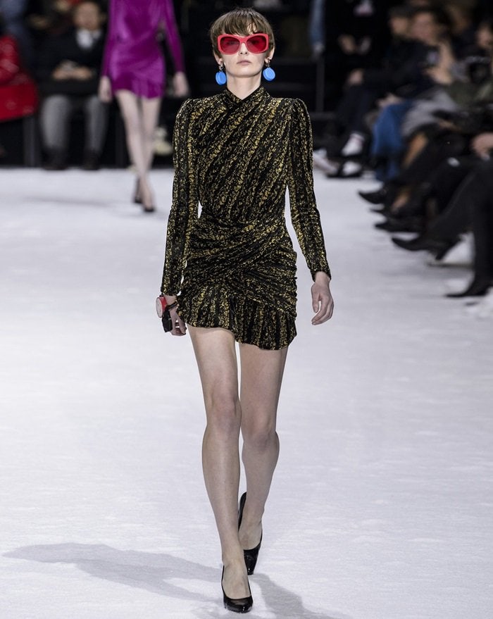 This black and gold mini dress debuted on Balenciaga's AW18 runway