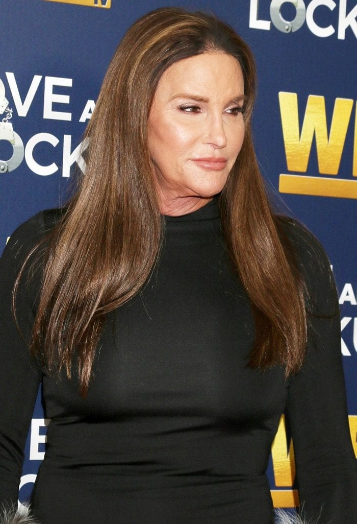 Caitlyn Jenner flaunts her breasts in a figure-hugging black dress