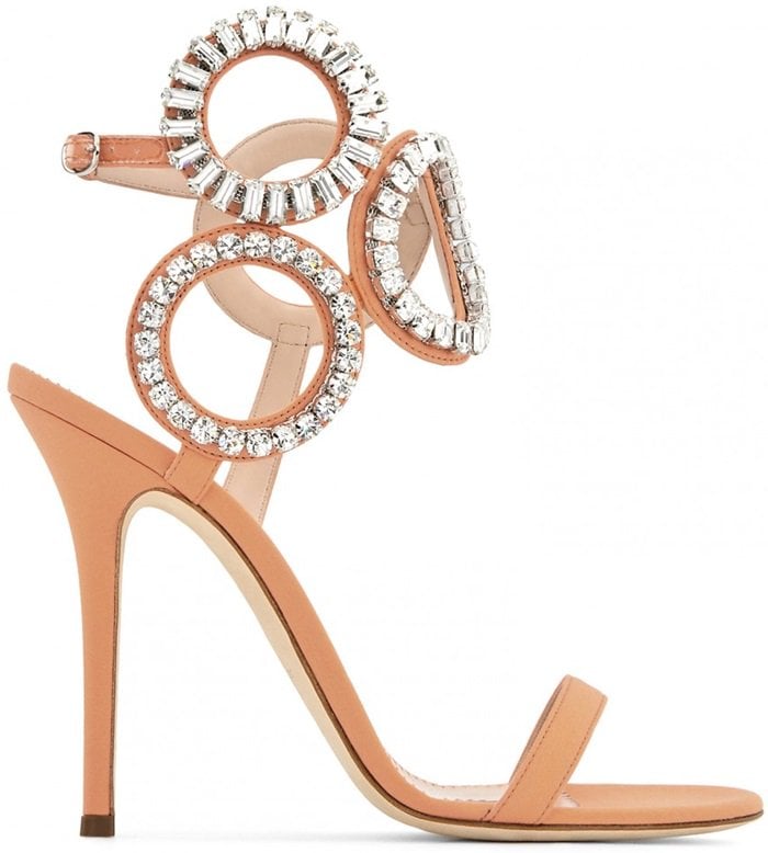 They are set on a stiletto heel and adorned with crystals on the geometric ankle strap