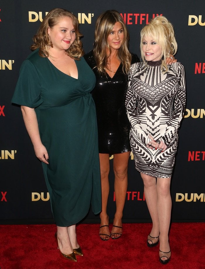 Danielle Macdonald, Jennifer Aniston, and Dolly Parton at the premiere of the Netflix movie Dumplin’ held at TCL Chinese 6 Theatres inside Los Angeles' Sunset Tower in Hollywood on December 6, 2018