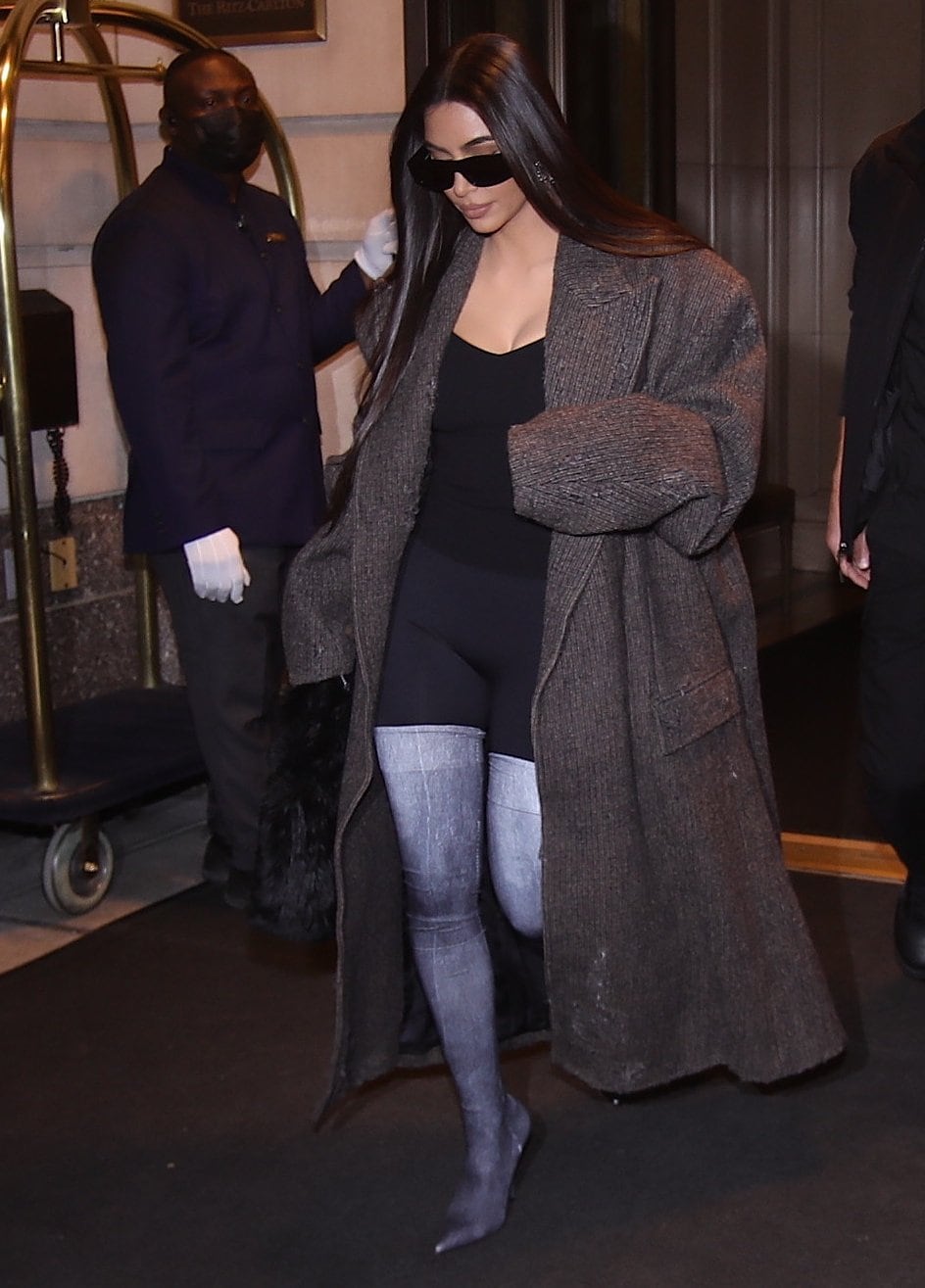 Kim Kardashian styled her distressed denim thigh-high Balenciaga boots with black leggings