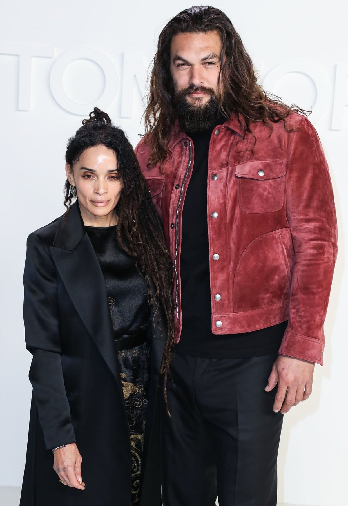 Jason Momoa, towering at 6'4", and his wife Lisa Bonet, who is 12 years his senior and stands at 5'2", make a striking couple with their notable height and age difference