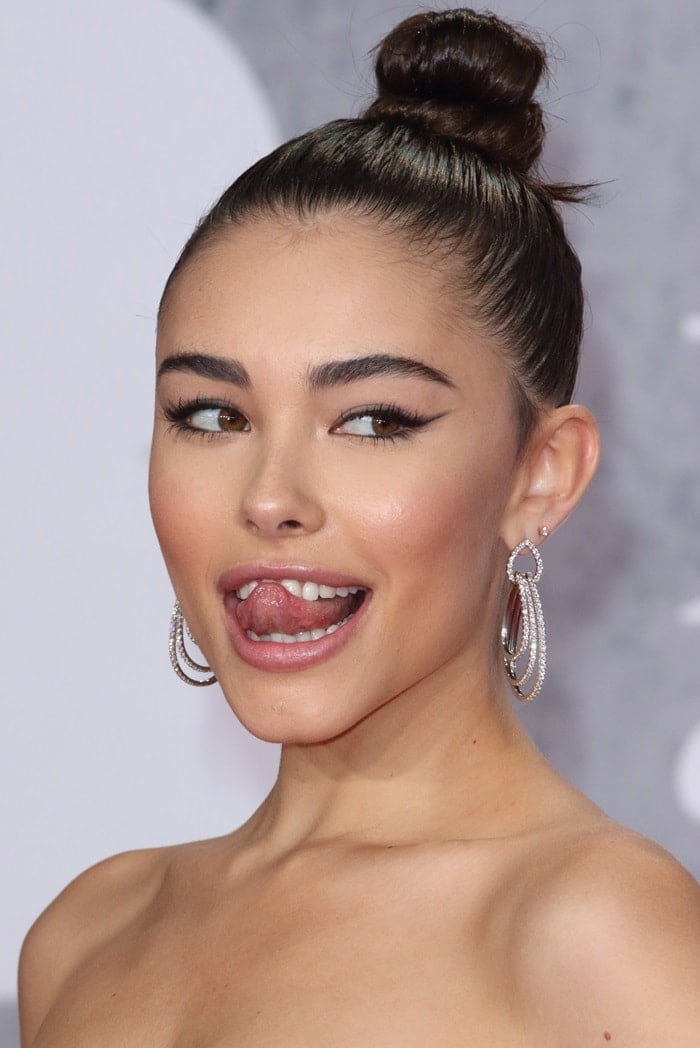 Madison Beer's tongue and Norman Silverman diamond earrings