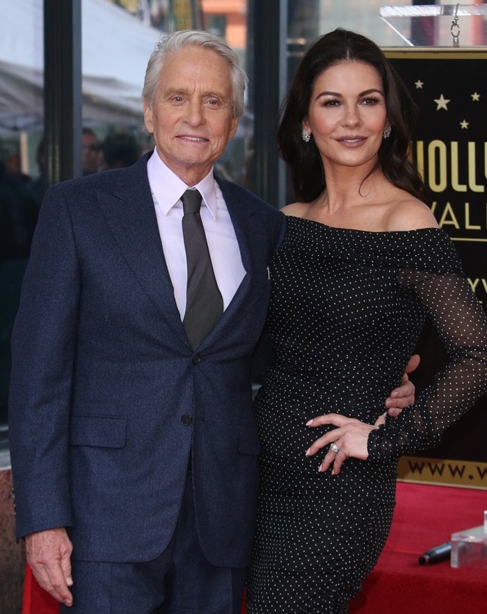 Michael Douglas posing with Catherine Zeta-Jones on the Hollywood Walk of Fame in Hollywood, California, on November 6, 2018