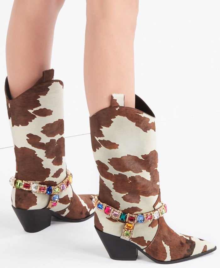 A decorative multicolor jewel adorns these metropolitan cowboy boots, creating an haute-couture street style model