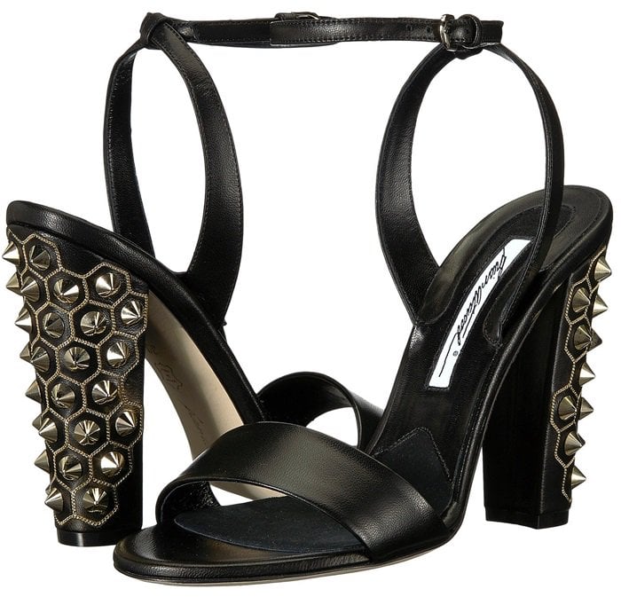 Crafted in Italy of black smooth leather, these ankle-strap sandals feature a tapered block heel embellished with polished goldtone metal studs and micro-curb chain