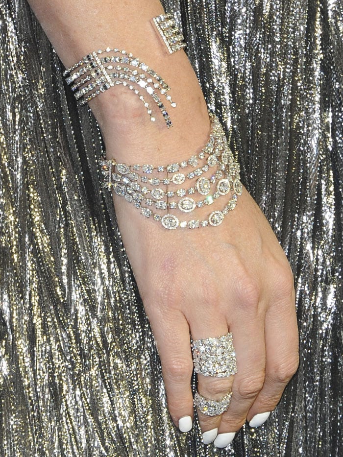 Details of the Messika 'Undine' and 'Starry Night' bracelets, 'Miss Milla' double ring, and 'Move' ring worn by Charlize Theron