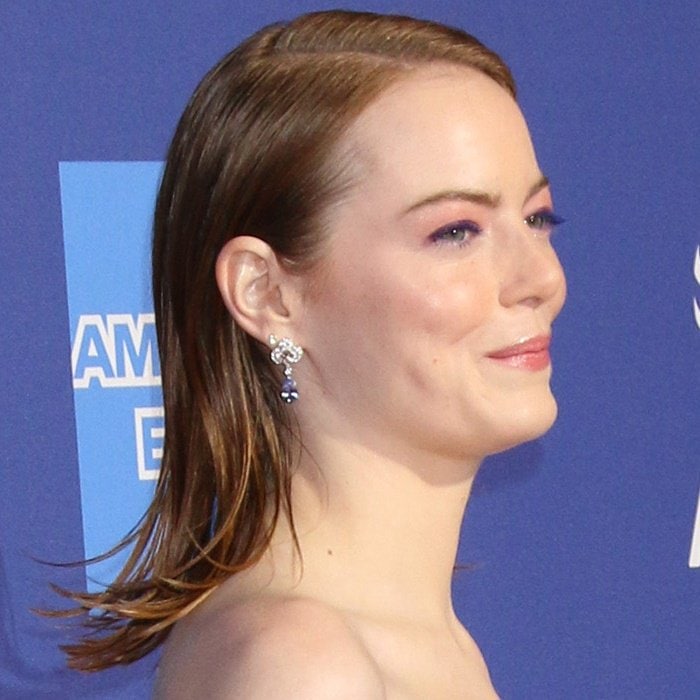 Emma Stone's hair with an off-center parting and diamond earrings