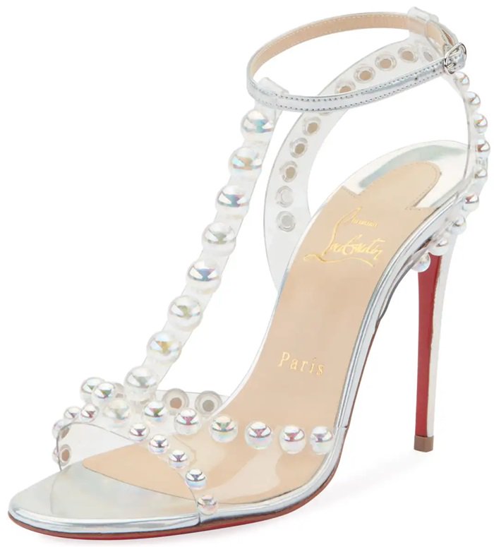 Crafted in Italy, they have clear PVC straps with pearl-like bubble bead embellishments, a buckled ankle strap and the label's signature red leather sole