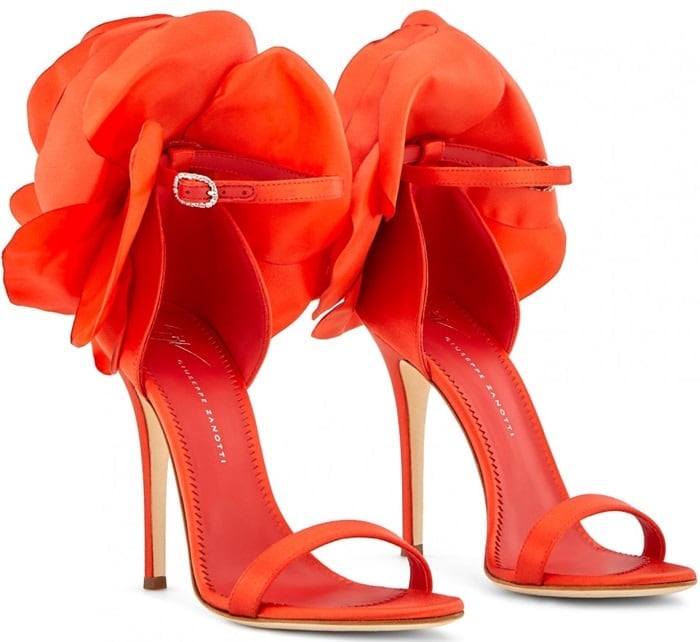 These sandals are made from red satin and are set on a stiletto heel and fasten with an ankle strap