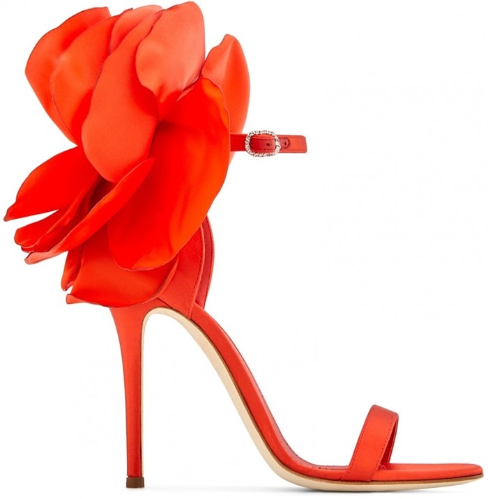 These sandals are made from red satin and are set on a stiletto heel and fasten with an ankle strap