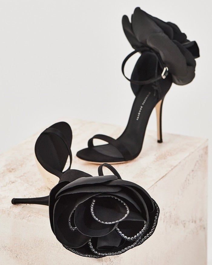 These couture sandals are made from black satin and adorned with the Peony Flower application trimmed with crystals
