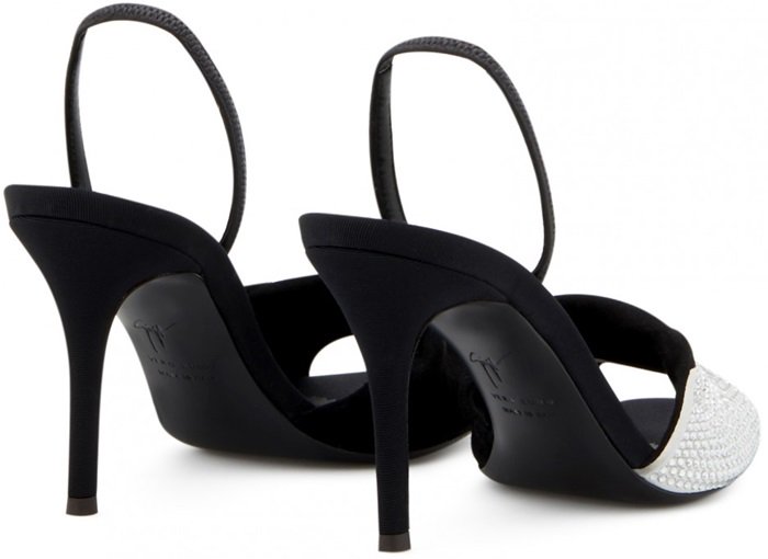Crafted from black and white suede with crystals, these sandals feature a crossover detail.