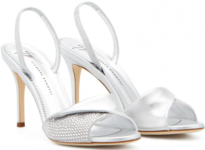 Crafted from cloud gray suede with crystals and silver metallic leather, these sandals feature a crossover detail