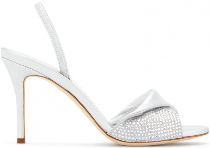 Crafted from cloud gray suede with crystals and silver metallic leather, these sandals feature a crossover detail