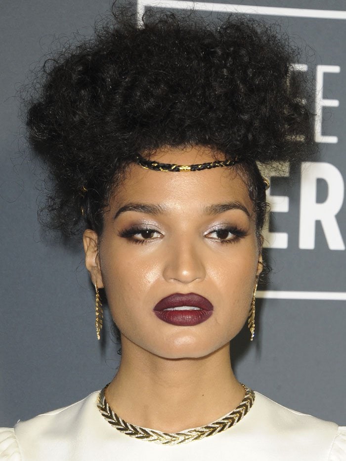 Indya Moore wearing a braided hairpiece and jewelry pieces from Hueb, Marco Bicego, and John Hardy