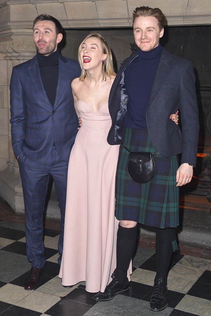 Saoirse Ronan flanked by her tartan-clad "Mary Queen of Scots" co-stars, James McCardle and Jack Lowden