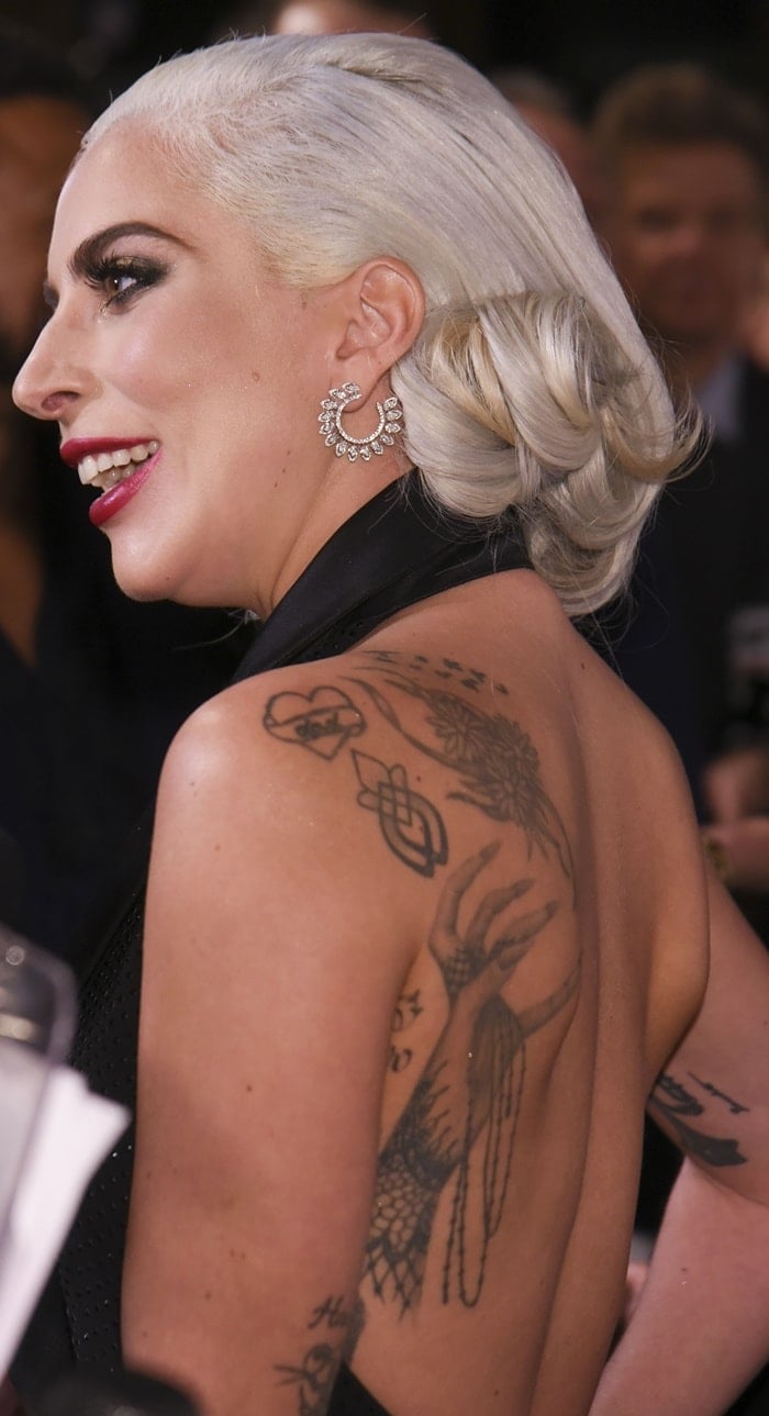 Lady Gagas Hand Turned Monster Paw And Survivor Back Tattoos 