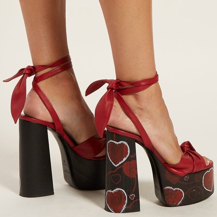 The painterly heart print that features on Saint Laurent’s towering red and black Paige sandals lends them a graphic edge