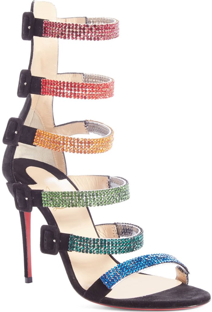 Black suede Raynibo sandals are encrusted with rows of multicolored crystals across the straps