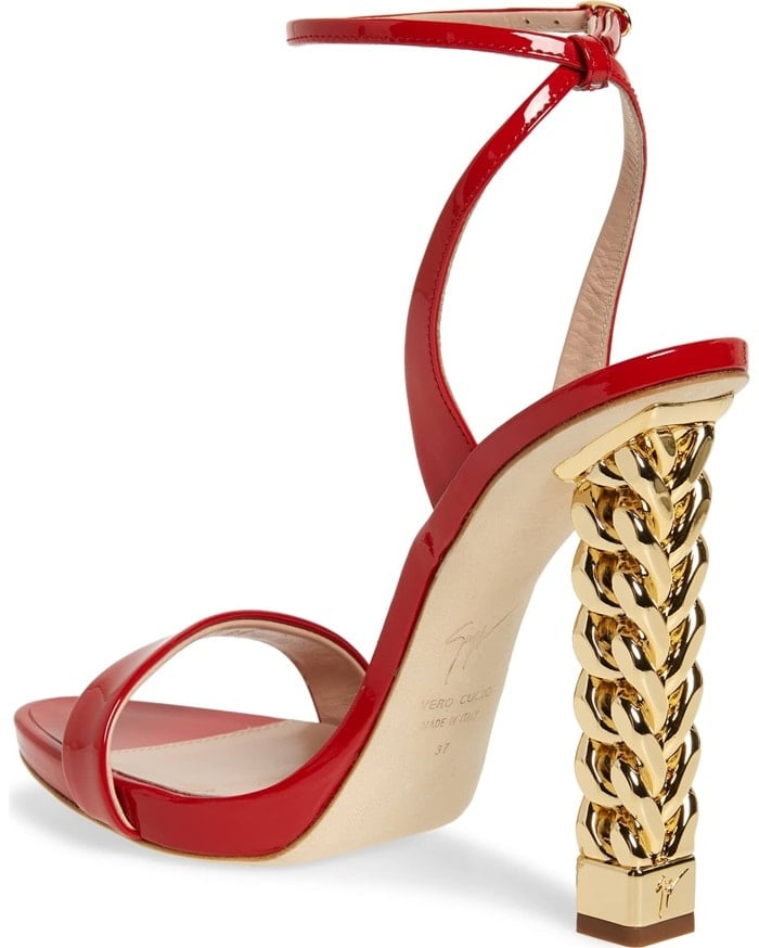 This red patent sandal makes a glam statement with a golden curb-chain heel