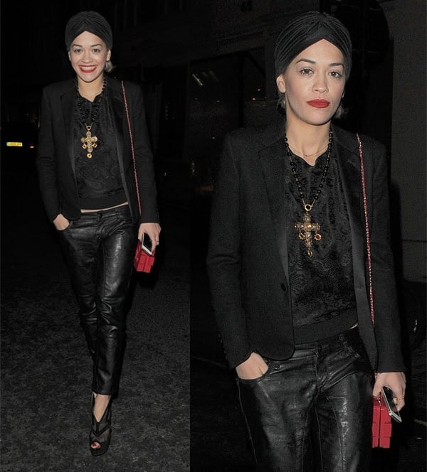 Rita Ora elegantly merges edgy and feminine styles by pairing a black blazer with leather pants, a lace top, and peep-toe platform heels that add height and drama to her chic ensemble
